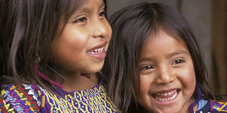 Close-up of two smiling childs. Public finances - Inter-American Development Bank - IDB
