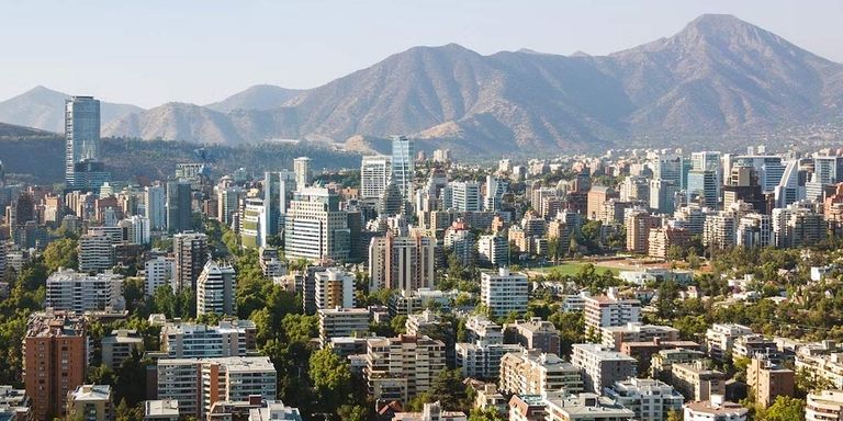Panoramic view of a city with mountains in the background