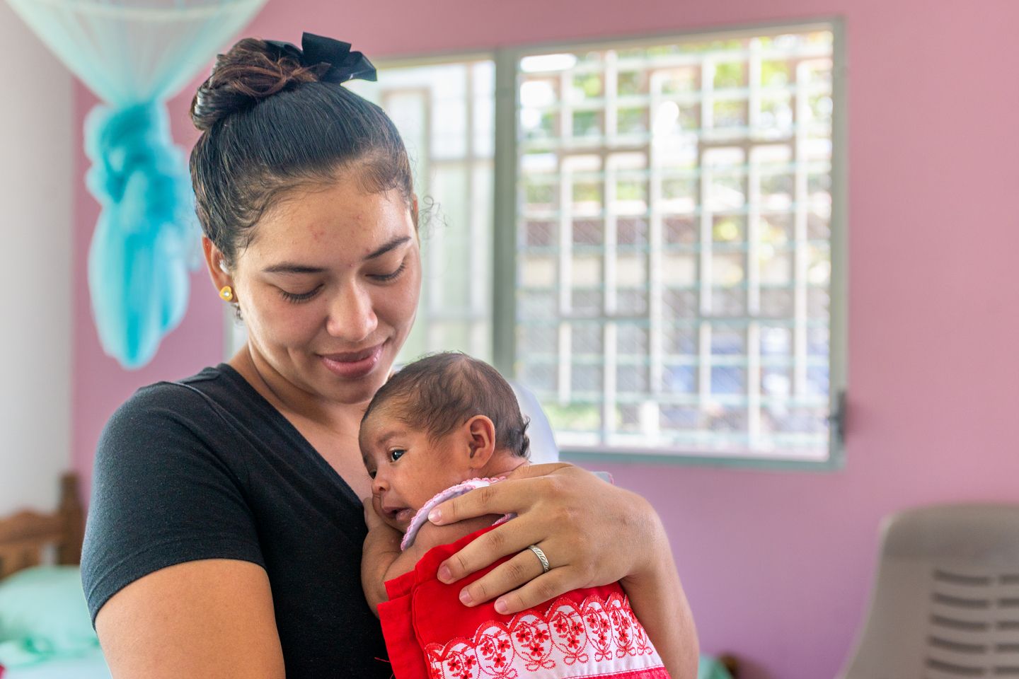 woman hugging a newborn