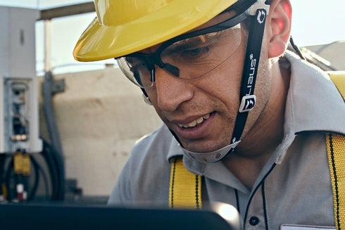 An operator with safety equipment working with machinery. Funding - Inter-American Development Bank - IDB