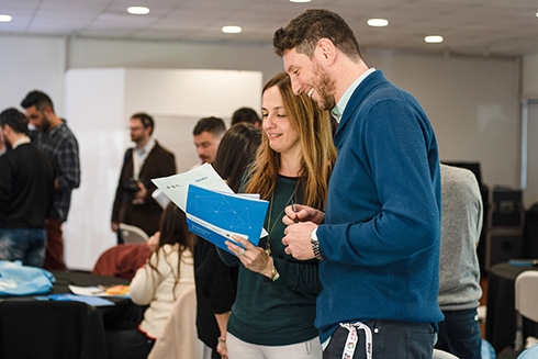 A man and a woman looking at papers