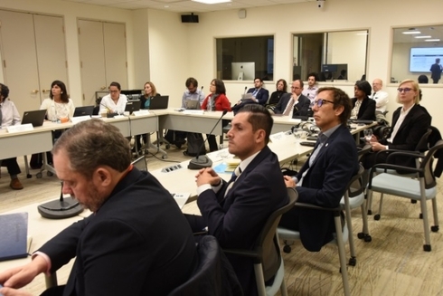 a group of people in a meeting