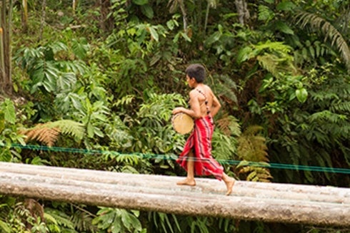 a child walking on a log