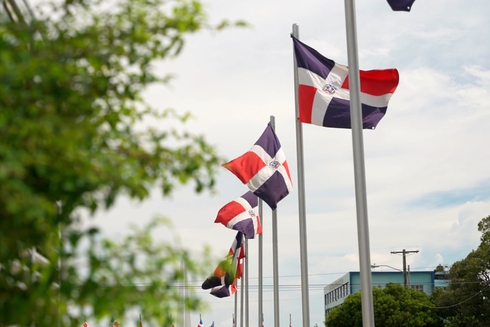 A row of flags on poles. Sustainable Development - Inter-American Development Bank - IDB