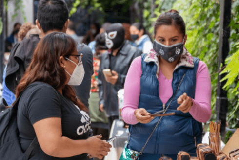 a person wearing a mask and a person wearing a mask health - Inter-American Development Bank - IDB