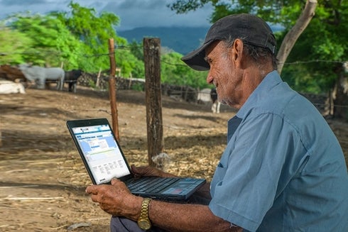 Grown Man using a Laptop - Data Research - Inter American Development Bank - IDB