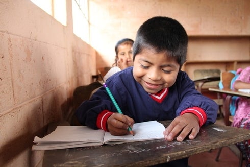 Boy Writing Notes - Investor - Inter American Development Bank - IDB