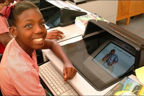 Student Girl Next to The Computer - Investor - Inter American Development Bank - IDB