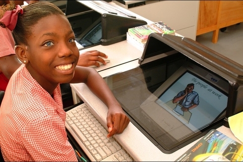 Student Girl Next to The Computer - Investor - Inter American Development Bank - IDB