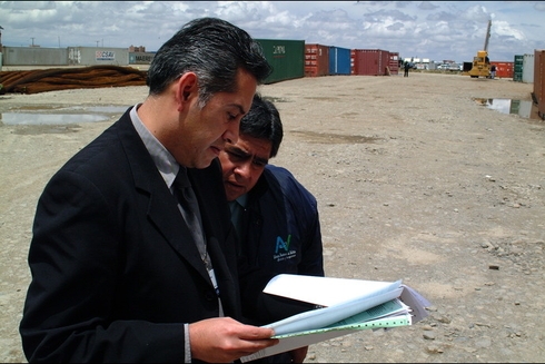 Men Reading Files - Investor - Inter American Development Bank - IDB