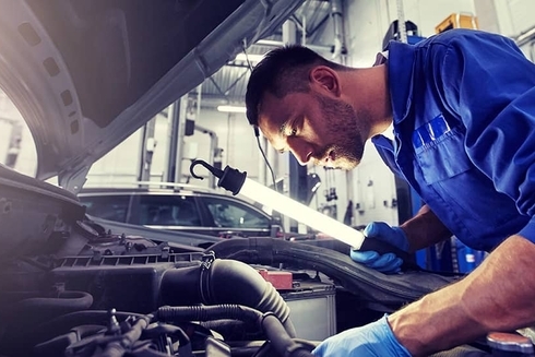 Man working on a car - Blogs - Inter American Development Bank - IDB