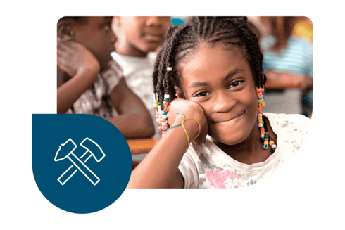 Girl smiling at the classroom - Project Evaluation Portal - Inter American Development Bank - IDB Project Evaluation Portal