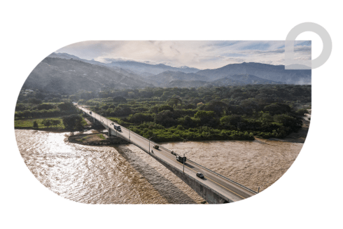 Panoramic day view of a bridge under a river on the horizon - Inter American Development Bank - Institutional Strategy