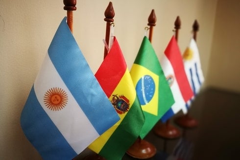 A set of Latin-American flags, symbolizing global connectivity and international cooperation - Regional Integration-  Inter-American Development Bank - IDB 