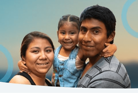 Migrant family smiling - Inter American Development Bank - Institutional Strategy