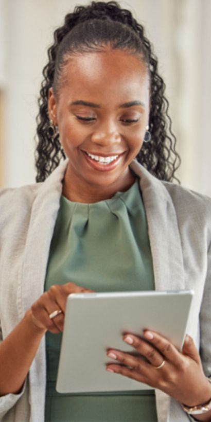 A woman reading from an iPad - IDB